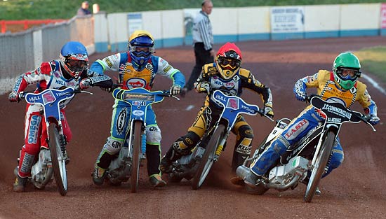 All 4 riders leaning into the first corner - note the elbows.jpg